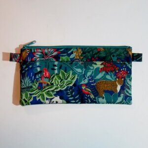 Clutch bag with jungle designs, 8-1/2 inches wide.